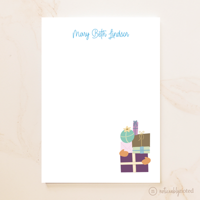 notepad with colorful gift boxes