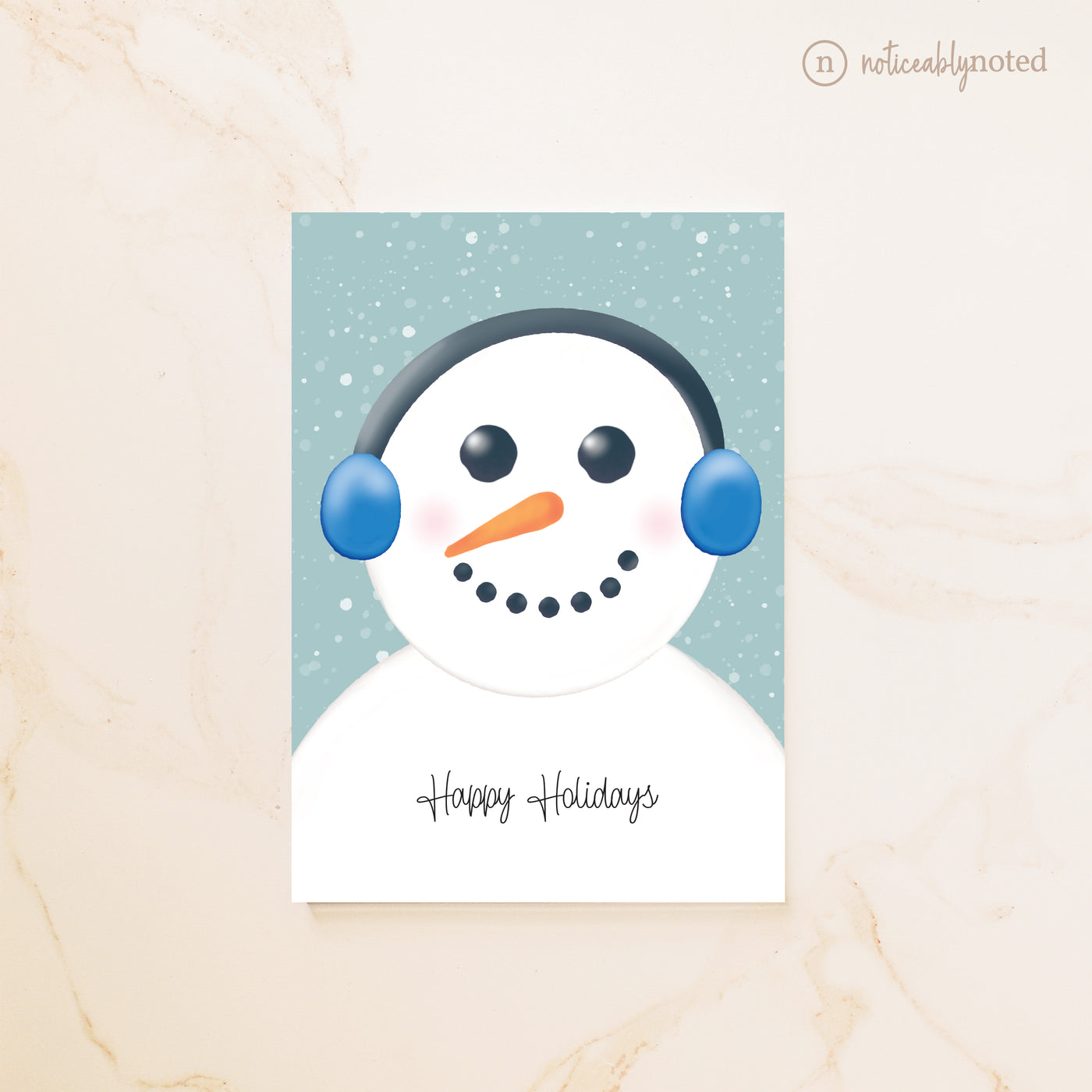 Card with a snowman design and 'Happy Holidays' text on a light background