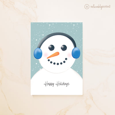 Card with a snowman design and 'Happy Holidays' text on a light background