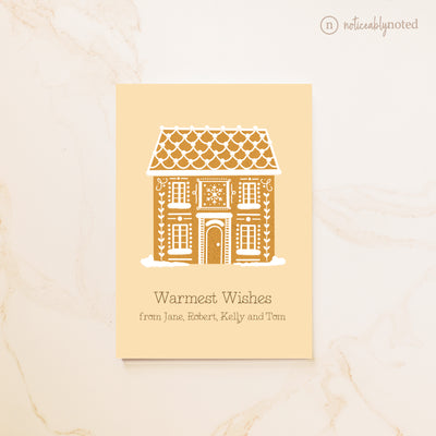 Greeting card with gingerbread house design on a beige background